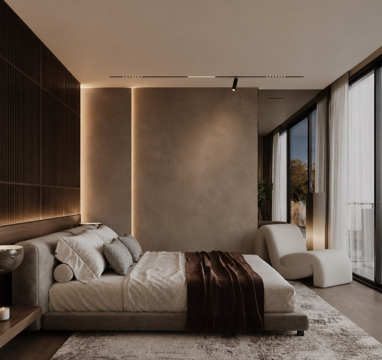 Master bedroom with textured plaster wall and garden view — luxury villa Seseh Bali